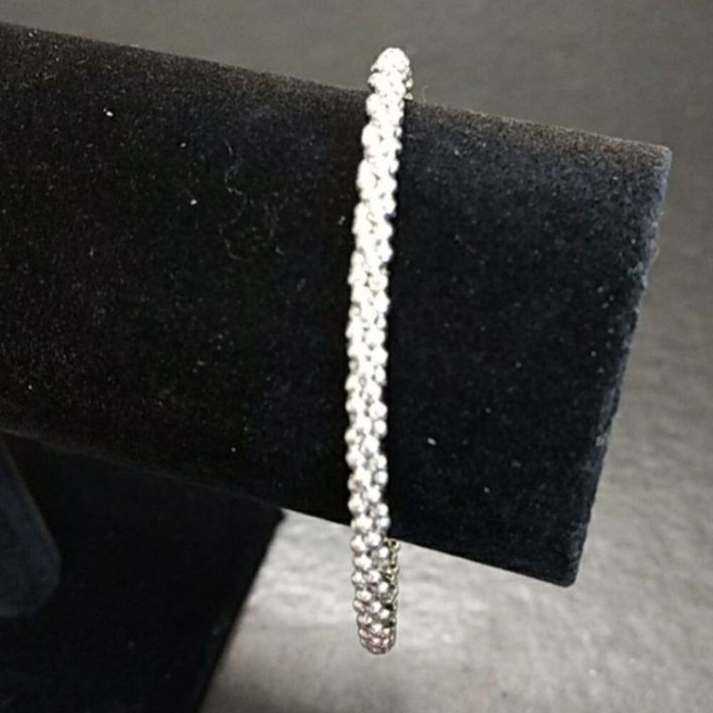 Silver tone bangle bracelet textured twist 8"